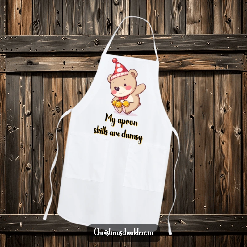 Funny apron featuring a bear in a clown hat and jingle bells hilariously tripping, perfect for adding humor to cooking adventures.