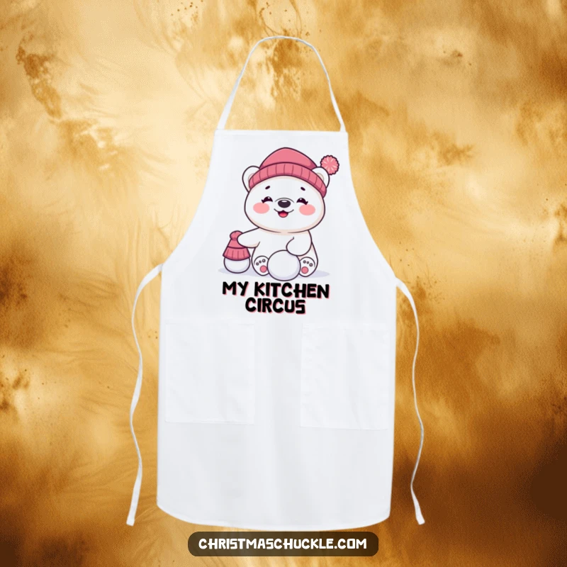 Funny apron featuring a giggling polar bear character hilariously trying to balance a hat and a snowball while cooking, a kitchen delight.