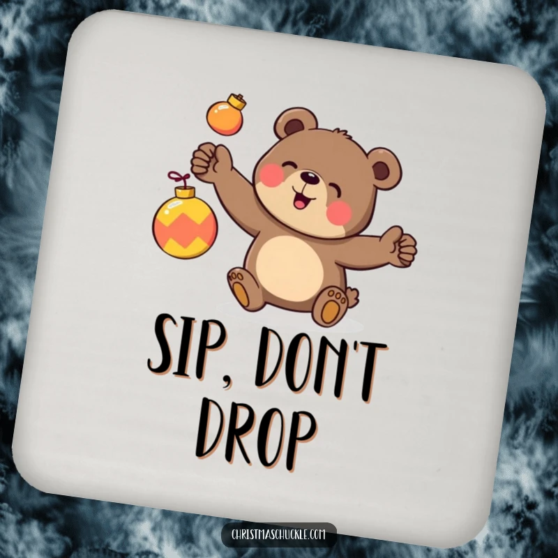 Funny drink coaster featuring a happy bear character clumsily juggling three brightly colored ornaments, a fun way to protect tables.