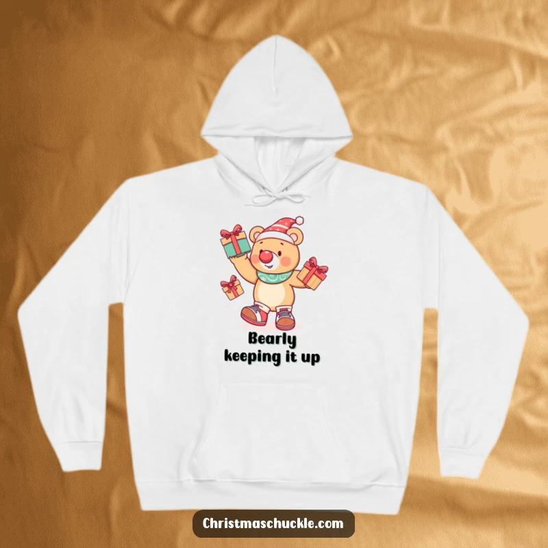 Funny festive bear in clown get-up juggling presents, featured on a soft and warm hoodie for ultimate comfort and humor.