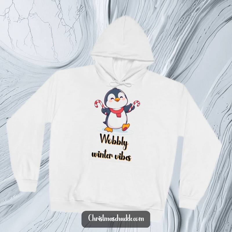 Funny cute penguin slipping on ice, juggling candy canes on a cozy hoodie, perfect for winter warmth and humor.