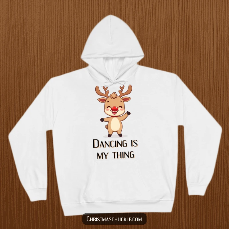 Funny hoodie showcasing a delighted reindeer character with a bright red nose attempting a silly dance, perfect for festive coziness.