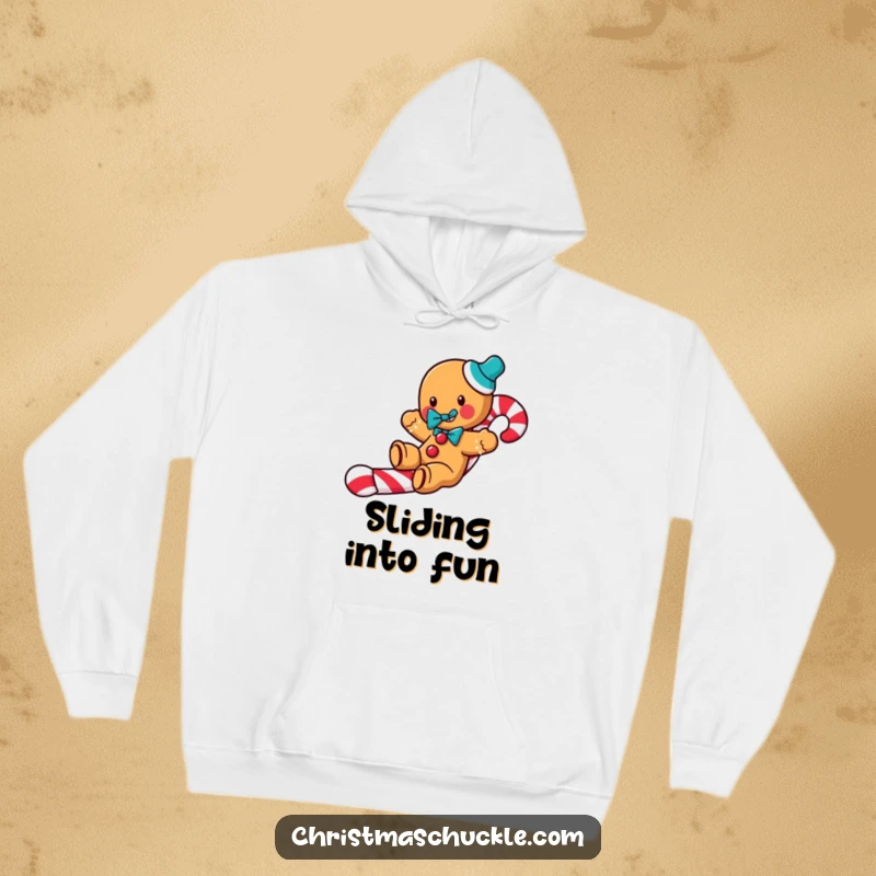 Funny Gingerbread Clown Hoodie: A jolly gingerbread man with a clown bow tie slides down a candy cane, perfect for cozy holiday humor.