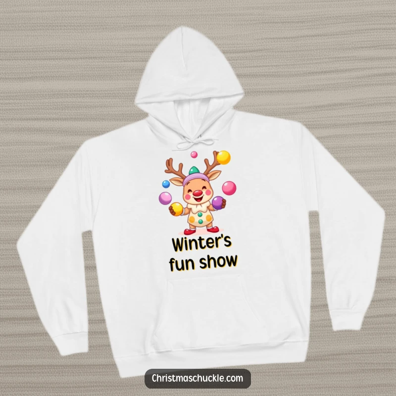 Funny hoodie featuring a smiling reindeer clown juggling brightly colored balls, perfect for cozy, laughter-filled holiday moments.