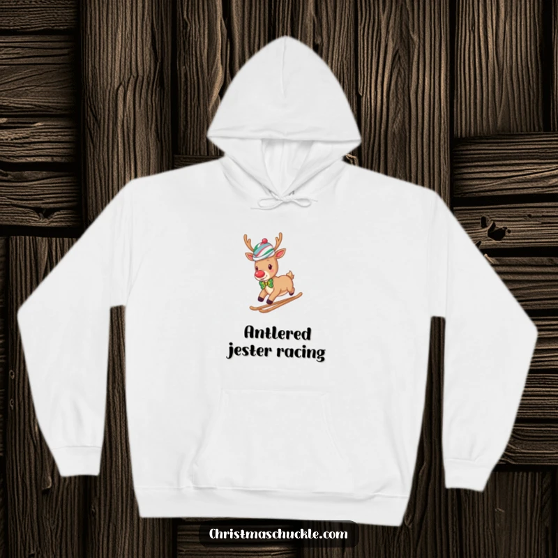 Funny reindeer clown wearing a wig and bow tie slides down a snowy hill, perfect for a cozy and humorous hoodie.