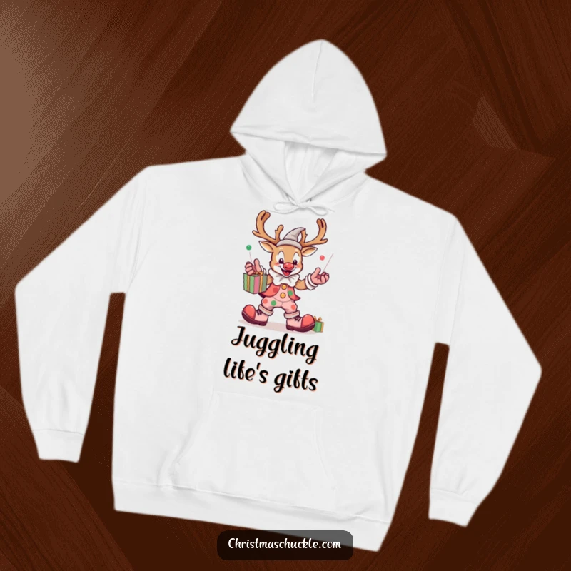 Funny kawaii reindeer clown juggling presents, cozy hoodie, warm and comfortable, festive and humorous design.