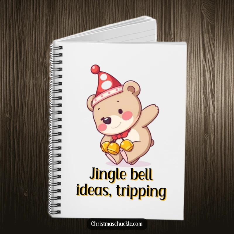 Funny notebook cover showing a bear in a clown hat and jingle bells tripping, ideal for doodling or jotting down funny thoughts.