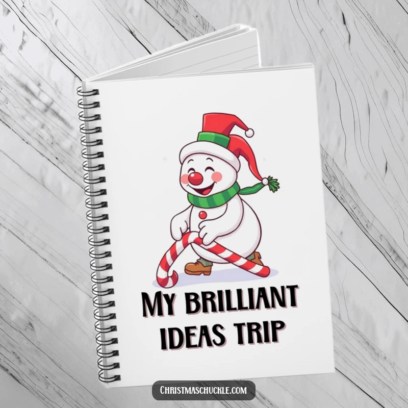 Funny snowman clown in a tiny top hat tripping over a candy cane, a humorous notebook for capturing thoughts and funny memories.