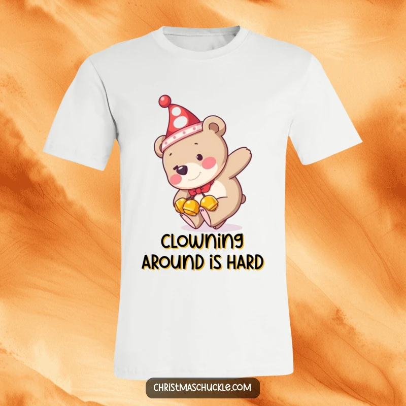 Funny t-shirt print of a bear wearing jingle bells and a clown hat, hilariously tripping over its own feet with a comical expression.