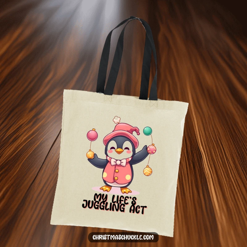 Funny tote bag featuring a penguin clown juggling festive baubles, perfect for everyday use and spreading holiday cheer with humor.