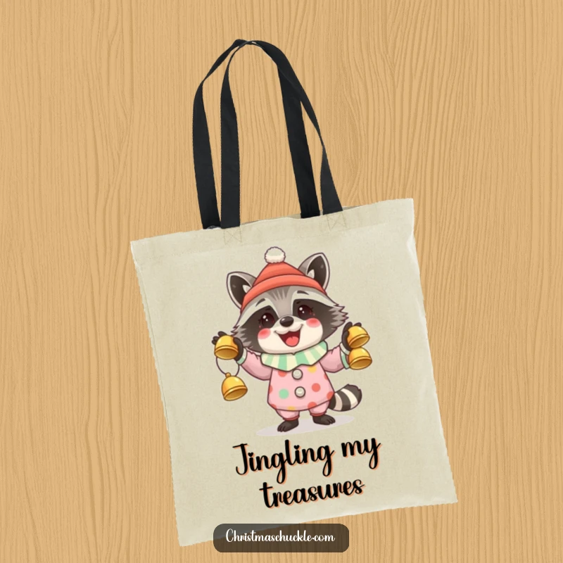 Funny tote bag displaying a happy raccoon in clown attire juggling three sparkling jingle bells.